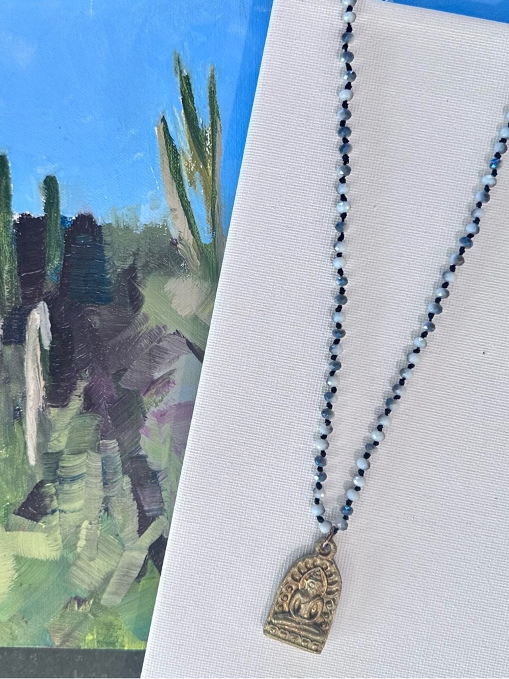 Beaded Pendant Necklace with Gold-Tone Buddha Charm